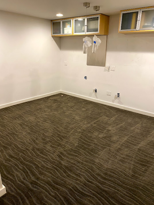 dark gray carpet with wave pattern in empty white office